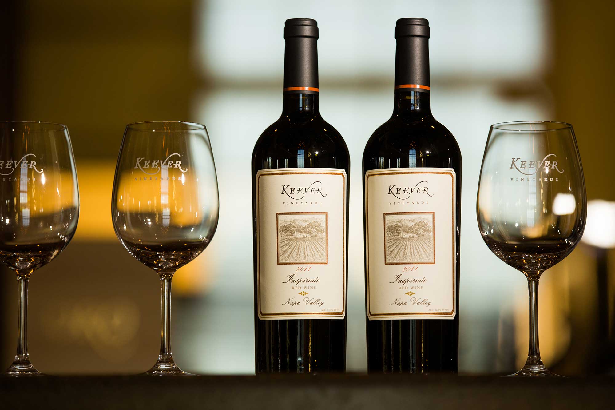 Keever Vineyards bottles and glasses in the winery tasting room in Yountville, California