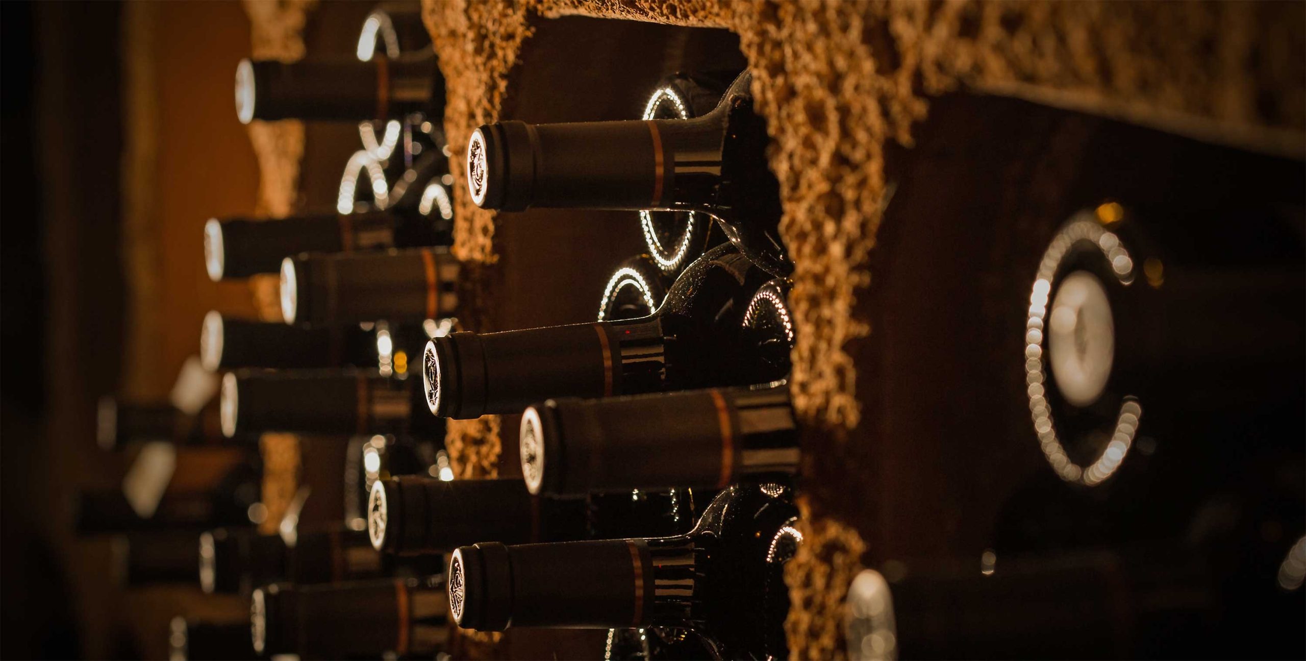 Bottles of Keever wine sticking out of the cave wall.
